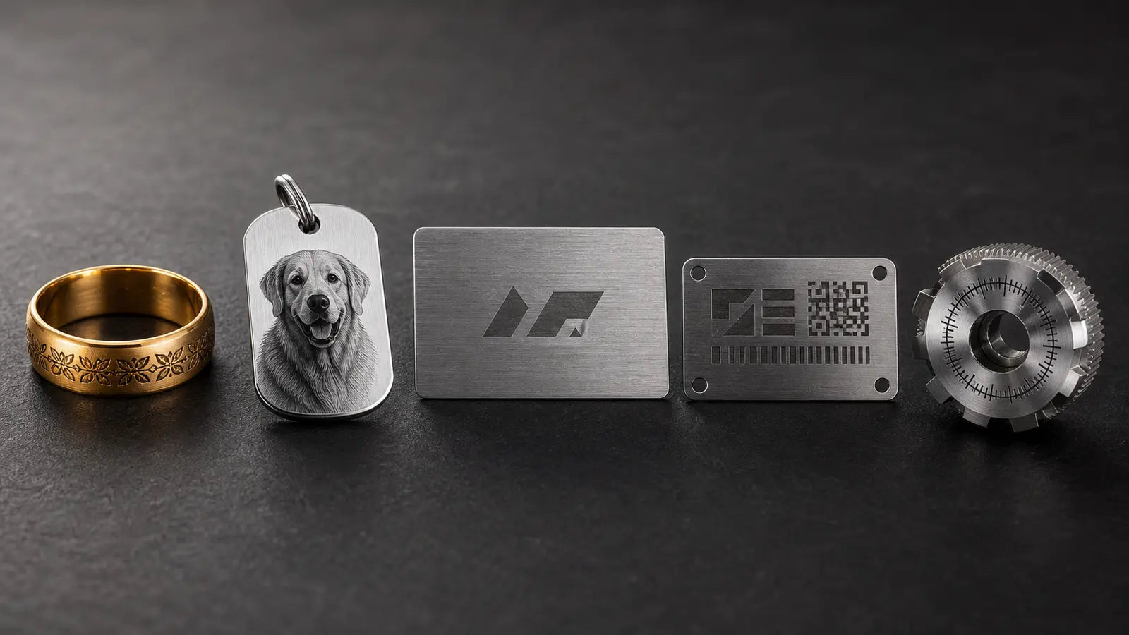 Mixed metal engraving samples including jewelry, metal cards, tags, and machined parts